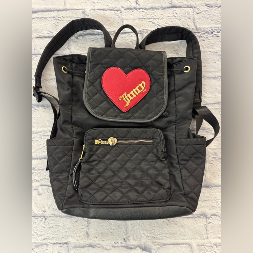 Juicy Couture black quilted backpack heart motif, drawstring top.